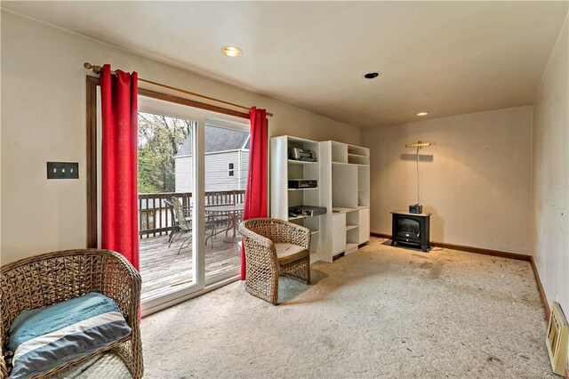 503 Beechwood Ave, Carnegie, PA 15106 - living area with carpet floors, recessed lighting, baseboards, and a wood stove