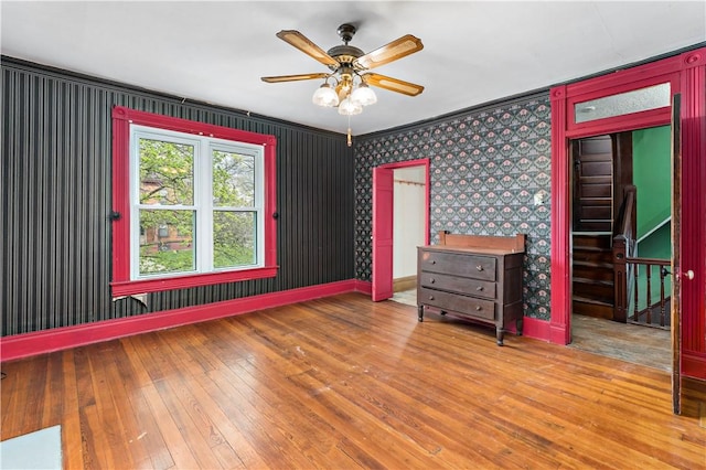503 Beechwood Ave, Carnegie, PA 15106 - unfurnished bedroom featuring a ceiling fan, wallpapered walls, baseboards, and hardwood / wood-style floors