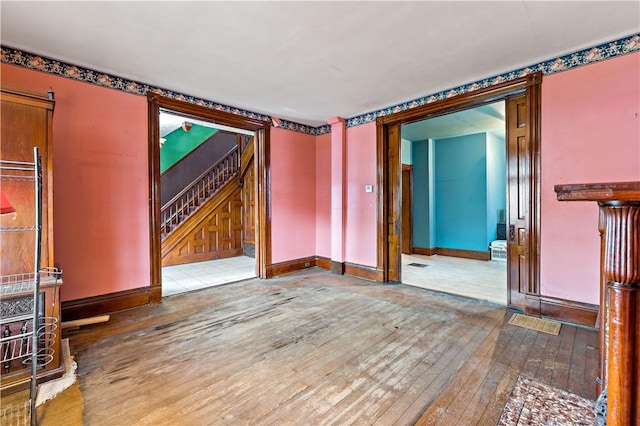 503 Beechwood Ave, Carnegie, PA 15106 - unfurnished living room featuring baseboards, stairs, and hardwood / wood-style flooring