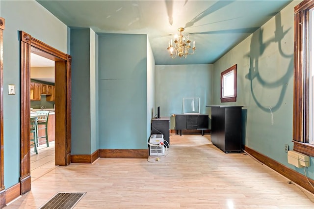 503 Beechwood Ave, Carnegie, PA 15106 - interior space featuring an inviting chandelier, baseboards, wood finished floors, and visible vents