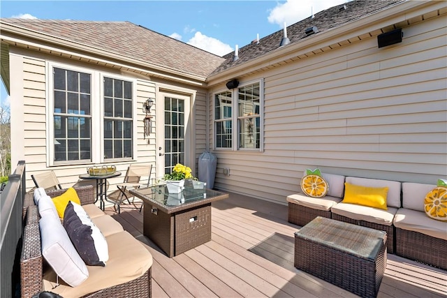 wooden terrace featuring an outdoor hangout area
