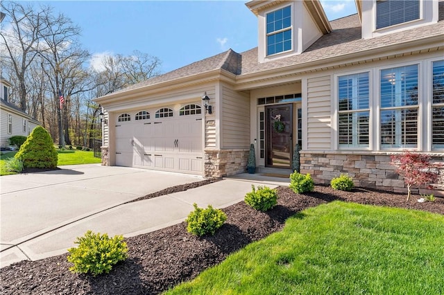 view of front of property with a shingled roof, an attached garage, a front lawn, stone siding, and driveway