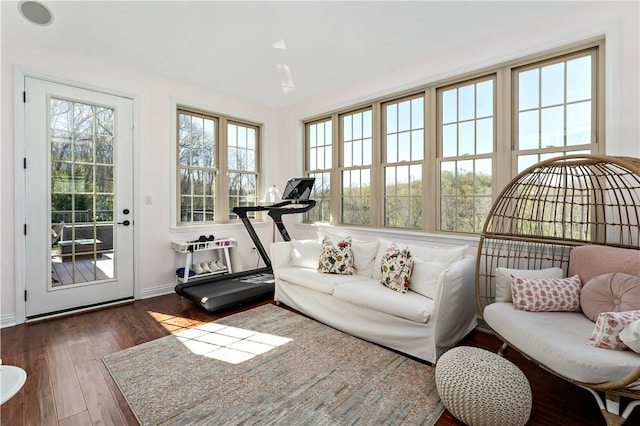 interior space with baseboards and hardwood / wood-style flooring
