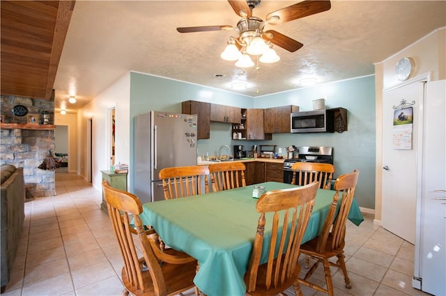 357 Pohls Rd, Raccoon Twp, PA 15001 - dining area featuring baseboards, ceiling fan, and light tile patterned floors