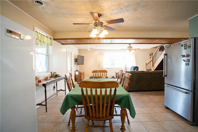 357 Pohls Rd, Raccoon Twp, PA 15001 - dining space featuring stairs, ceiling fan, light tile patterned floors, and a healthy amount of sunlight