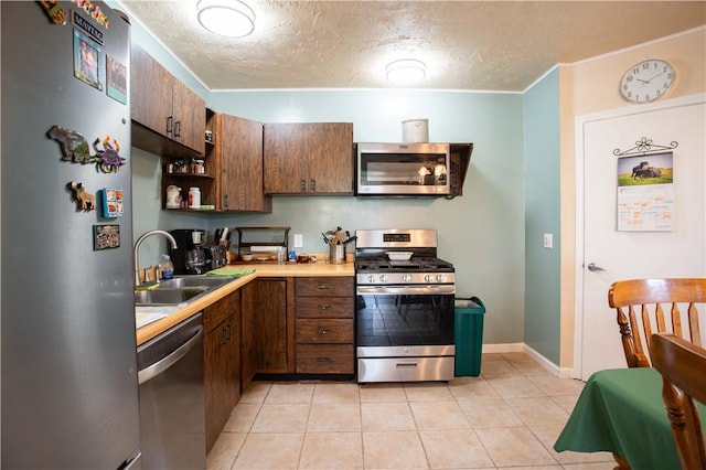 357 Pohls Rd, Raccoon Twp, PA 15001 - kitchen with open shelves, a sink, light countertops, a textured ceiling, and stainless steel appliances