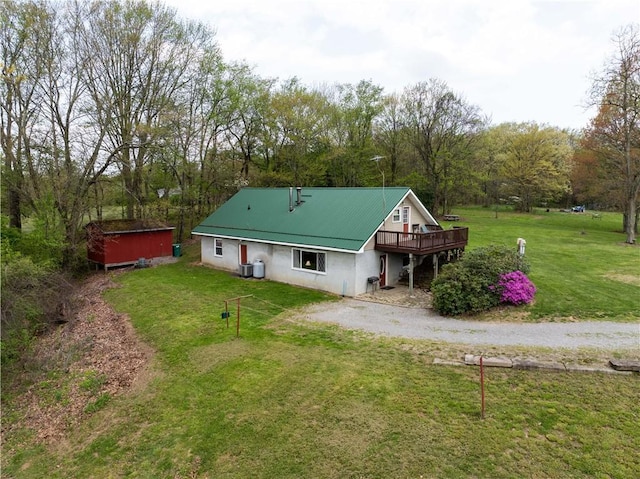 357 Pohls Rd, Raccoon Twp, PA 15001 - rear view of property featuring a lawn, dirt driveway, central air condition unit, and a deck