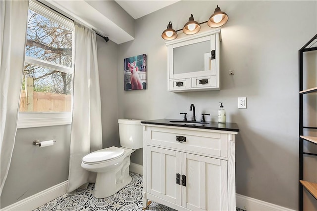 308 Jacksonia St, Central North Side, PA 15212 - half bathroom with baseboards, tile patterned flooring, toilet, and vanity