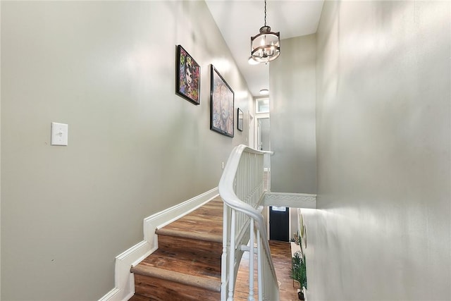 308 Jacksonia St, Central North Side, PA 15212 - stairway featuring baseboards, an inviting chandelier, and wood finished floors