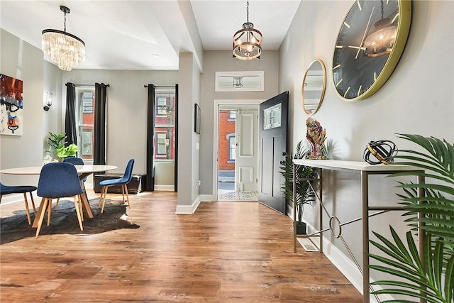 308 Jacksonia St, Central North Side, PA 15212 - entrance foyer featuring baseboards, a notable chandelier, and wood finished floors