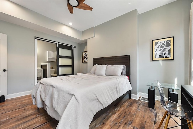 308 Jacksonia St, Central North Side, PA 15212 - bedroom featuring a barn door, baseboards, recessed lighting, and wood finished floors