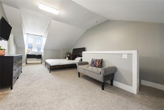 308 Jacksonia St, Central North Side, PA 15212 - bedroom with baseboards, vaulted ceiling, and light carpet