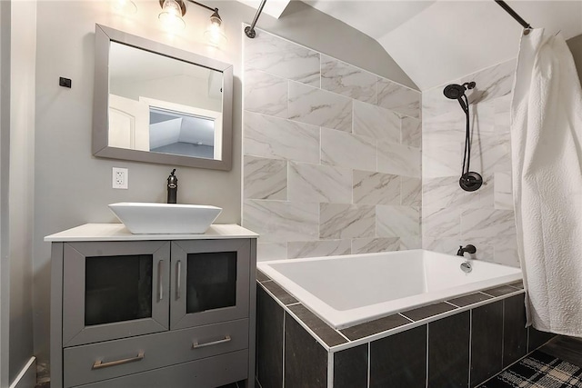 308 Jacksonia St, Central North Side, PA 15212 - bathroom featuring vanity, vaulted ceiling, and tiled shower / bath combo