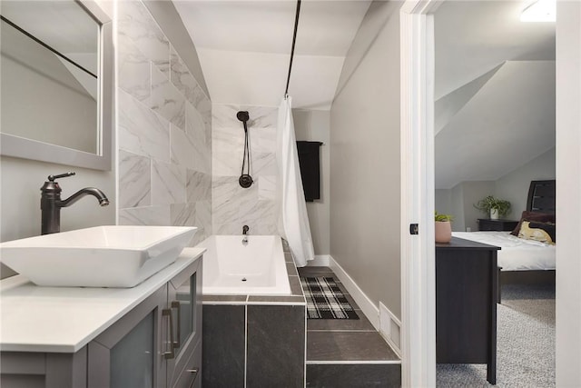 308 Jacksonia St, Central North Side, PA 15212 - ensuite bathroom featuring vanity, baseboards, ensuite bathroom, and shower / tub combo
