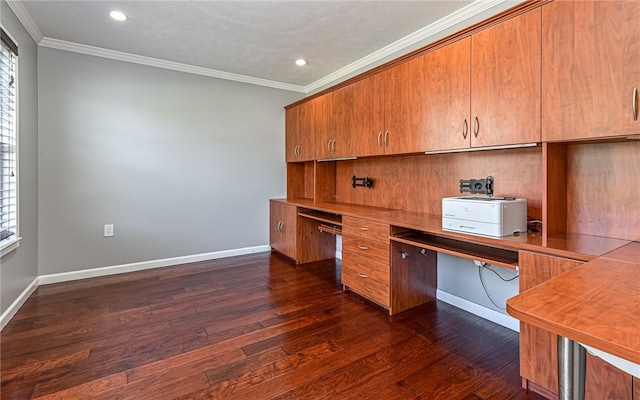 unfurnished office with baseboards, dark wood-style floors, ornamental molding, and a wealth of natural light