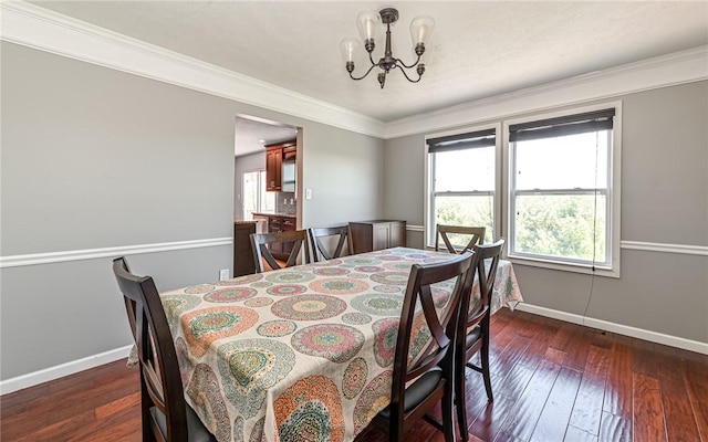 dining room featuring baseboards, dark wood-style flooring, and a chandelier