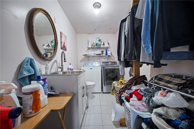 206 7th St, Oakmont, PA 15139 - washroom featuring washer and clothes dryer, light tile patterned flooring, and cabinet space