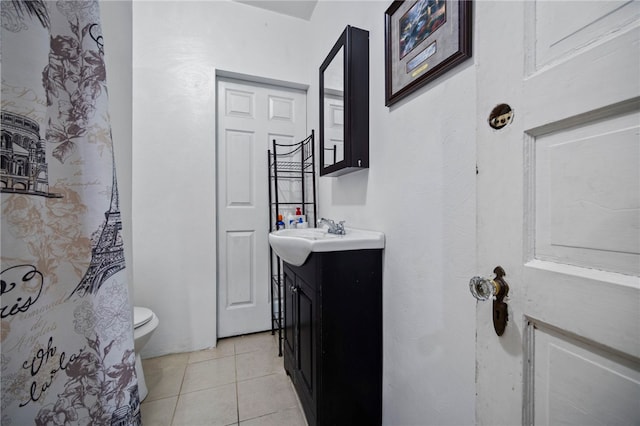 206 7th St, Oakmont, PA 15139 - bathroom with vanity, toilet, and tile patterned flooring