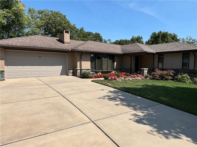 ranch-style house featuring a front lawn, stone siding, a garage, a chimney, and concrete driveway