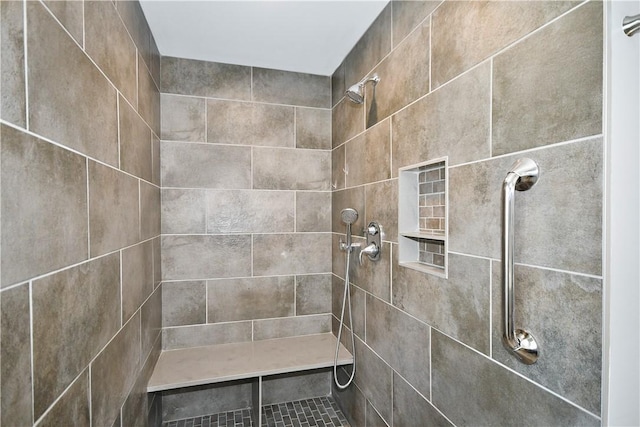 bathroom with a tile shower