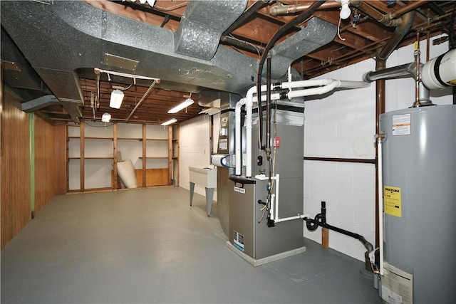unfinished below grade area with a sink and water heater