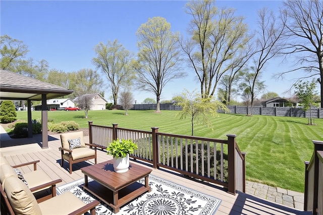 wooden deck with fence, a yard, and an outdoor hangout area