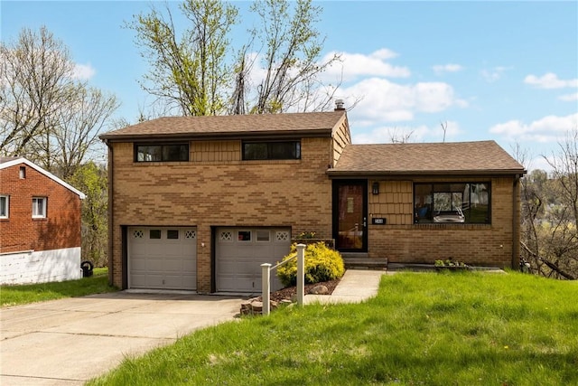 split level home with brick siding, a front lawn, an attached garage, and concrete driveway