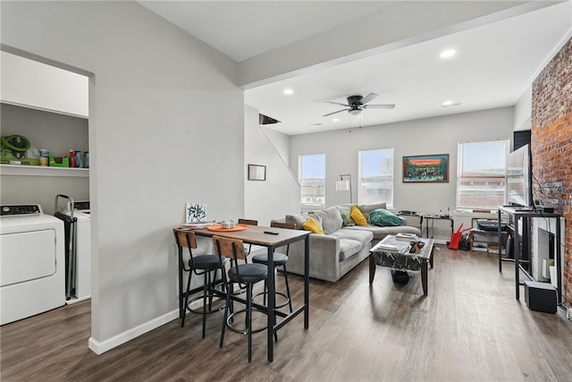 living room featuring ceiling fan, recessed lighting, baseboards, wood finished floors, and washer and clothes dryer