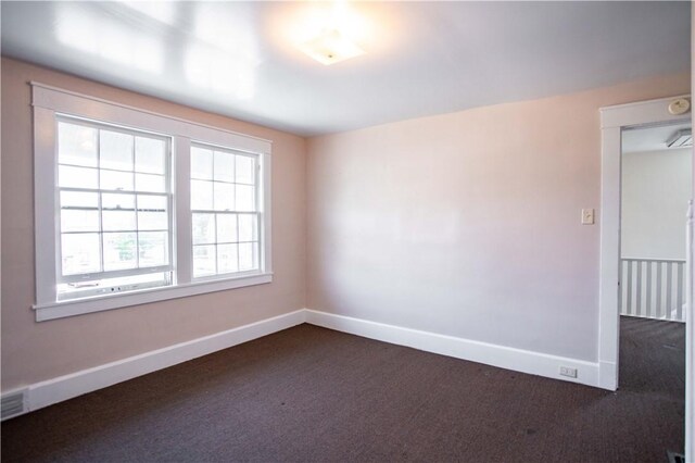 1315 Main St, Aliquippa, PA 15001 - spare room featuring dark colored carpet and baseboards