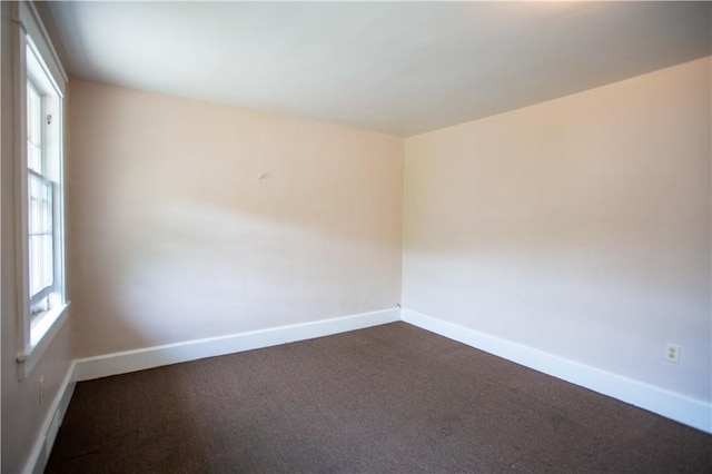 1315 Main St, Aliquippa, PA 15001 - empty room with baseboards and dark colored carpet