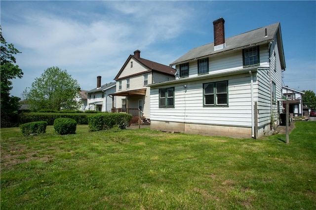 1315 Main St, Aliquippa, PA 15001 - back of property with a yard and a chimney