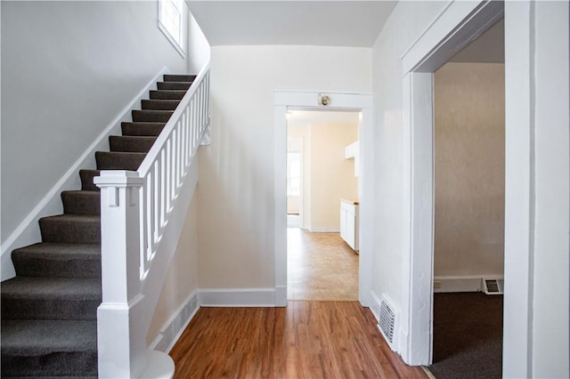 1315 Main St, Aliquippa, PA 15001 - staircase with baseboards, visible vents, and wood finished floors