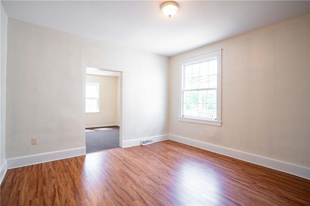 1315 Main St, Aliquippa, PA 15001 - spare room featuring plenty of natural light, baseboards, and wood finished floors