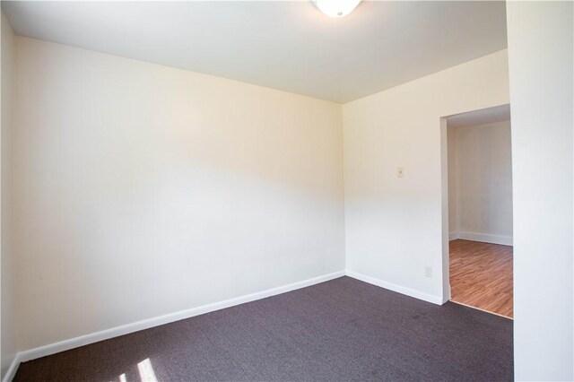 1315 Main St, Aliquippa, PA 15001 - empty room with baseboards and dark colored carpet