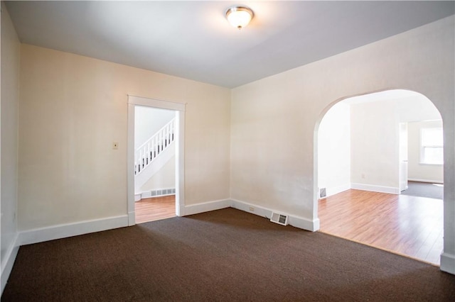 1315 Main St, Aliquippa, PA 15001 - carpeted spare room with arched walkways, baseboards, and visible vents