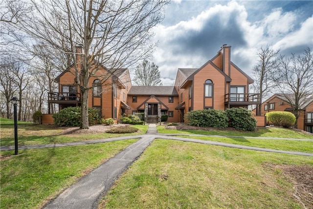 2805 Swiss Mountain Dr, Seven Springs Resort, PA 15622 - view of front of house featuring a front lawn, a balcony, and a chimney