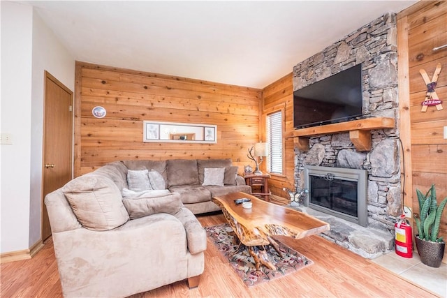 2805 Swiss Mountain Dr, Seven Springs Resort, PA 15622 - living room featuring baseboards, wood walls, wood finished floors, and a fireplace