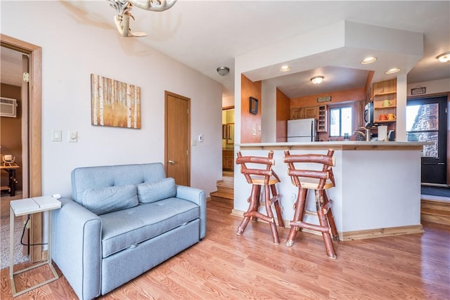 2805 Swiss Mountain Dr, Seven Springs Resort, PA 15622 - living area featuring recessed lighting, a wall unit AC, and light wood-style floors