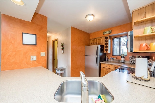 2805 Swiss Mountain Dr, Seven Springs Resort, PA 15622 - kitchen with brown cabinetry, freestanding refrigerator, open shelves, light countertops, and a sink