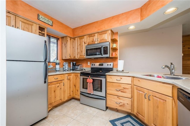 2805 Swiss Mountain Dr, Seven Springs Resort, PA 15622 - kitchen with appliances with stainless steel finishes, light brown cabinetry, a sink, light tile patterned floors, and light countertops