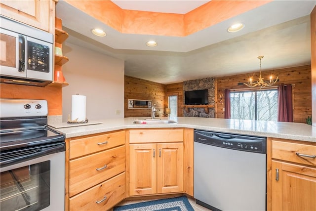 2805 Swiss Mountain Dr, Seven Springs Resort, PA 15622 - kitchen with a sink, light countertops, an inviting chandelier, and stainless steel appliances