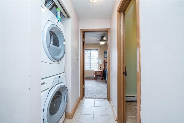 2805 Swiss Mountain Dr, Seven Springs Resort, PA 15622 - laundry area with laundry area, stacked washer and dryer, ceiling fan, a baseboard heating unit, and light tile patterned floors