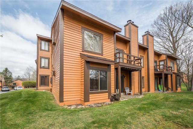 2805 Swiss Mountain Dr, Seven Springs Resort, PA 15622 - back of property featuring a chimney, a yard, and a balcony