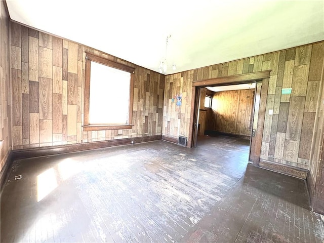 432 Boyles Ave, New Castle/2Nd, PA 16101 - unfurnished room with wood walls and hardwood / wood-style floors