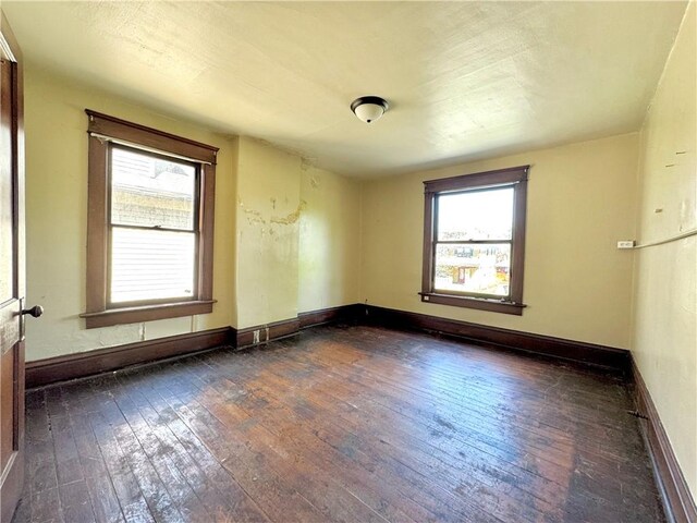 432 Boyles Ave, New Castle/2Nd, PA 16101 - empty room with baseboards, dark wood-style floors, and plenty of natural light
