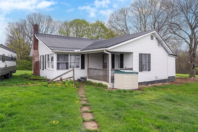 114 Angel Ave, Fairview Twp But, PA 16050 - ranch-style house featuring a chimney, a front yard, and metal roof