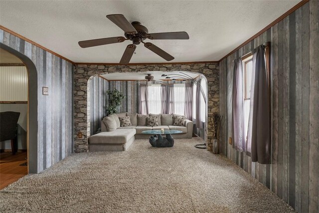 114 Angel Ave, Fairview Twp But, PA 16050 - living area featuring ornamental molding, a ceiling fan, a textured ceiling, and arched walkways