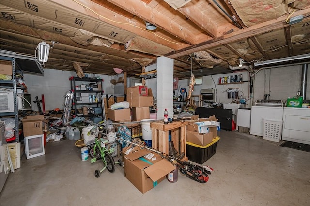 below grade area featuring washer and clothes dryer