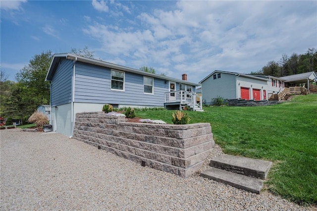 view of front of home featuring a chimney and a front yard