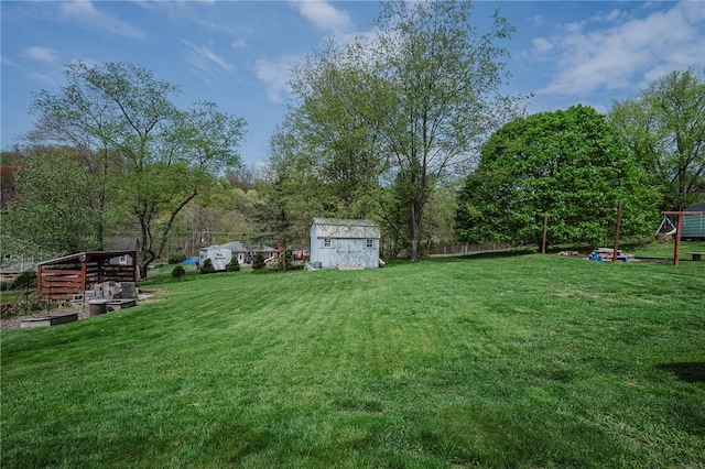 view of yard with an outbuilding and a shed